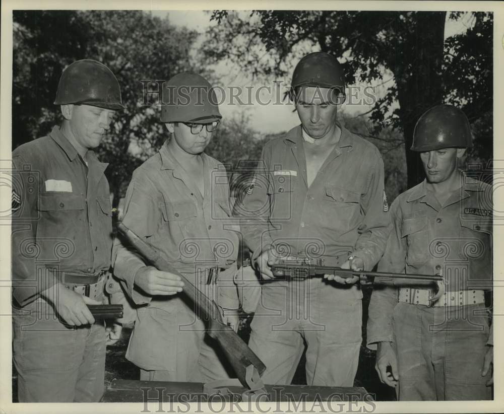 1956 Press Photo Houston Army Reserve 974th QM members study rifles; Ft. Hood