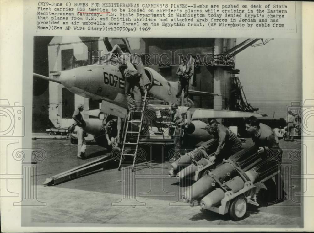 1967 Press Photo Bombs pushed on deck of USS American; Eastern Mediterranean