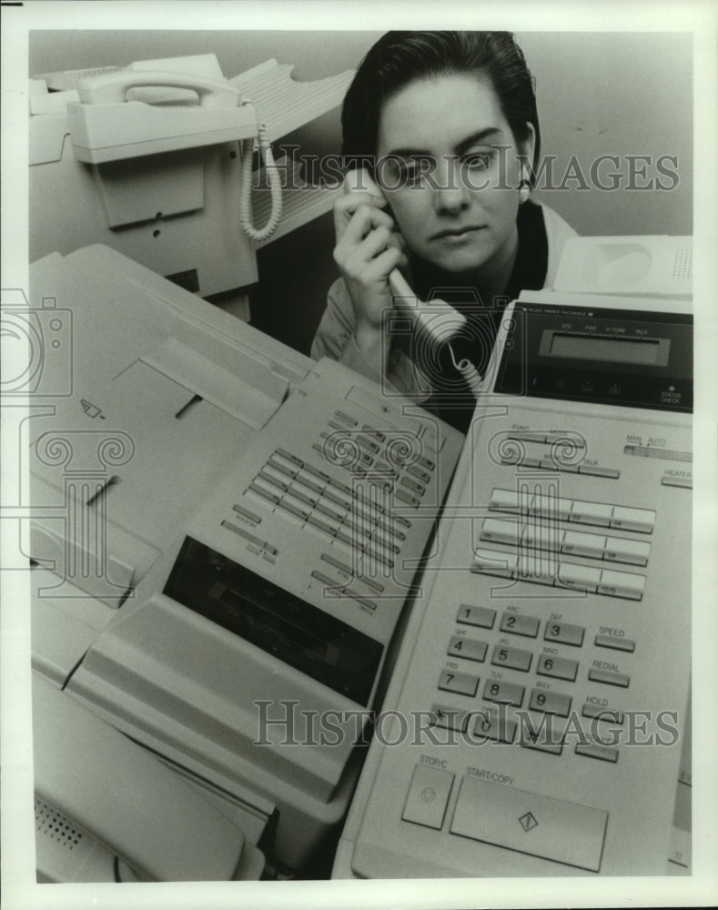 1992 Press Photo Quality control technician tests fax machine in New Jersey- Historic Images