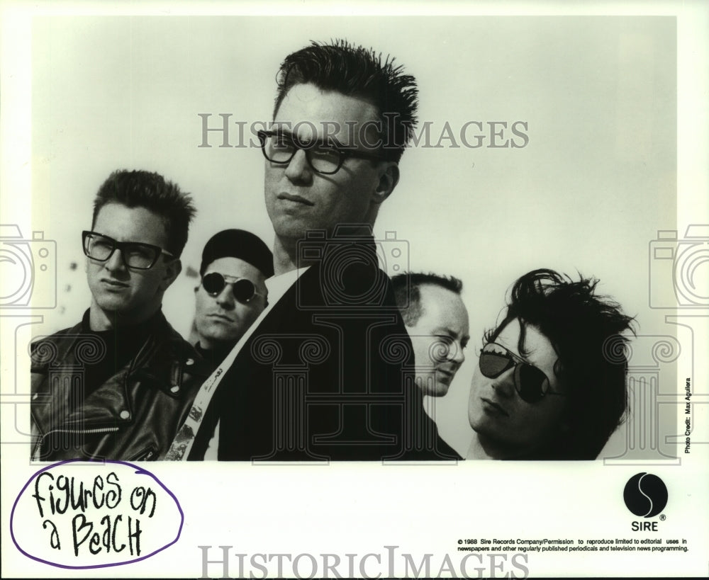 1988 Press Photo Figures On A Beach rock music group. - hcp03555- Historic Images