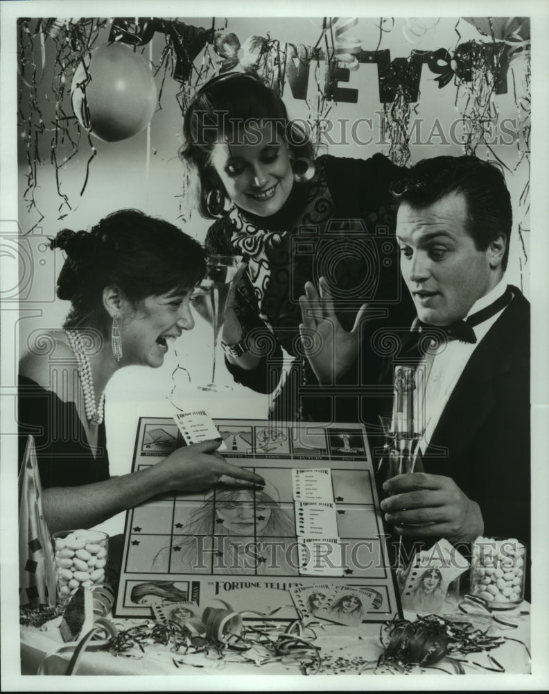 1990 Press Photo Group plays the new Fortune Teller board game - hcp04129- Historic Images