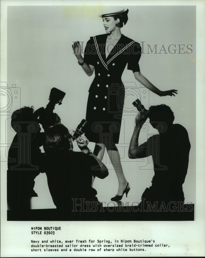 1989 Press Photo Model with double-breasted sailor dress at Nipon Boutique.- Historic Images