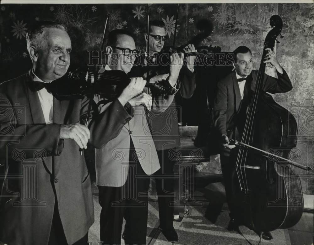 Press Photo Members of orchestra pose perform with their instruments