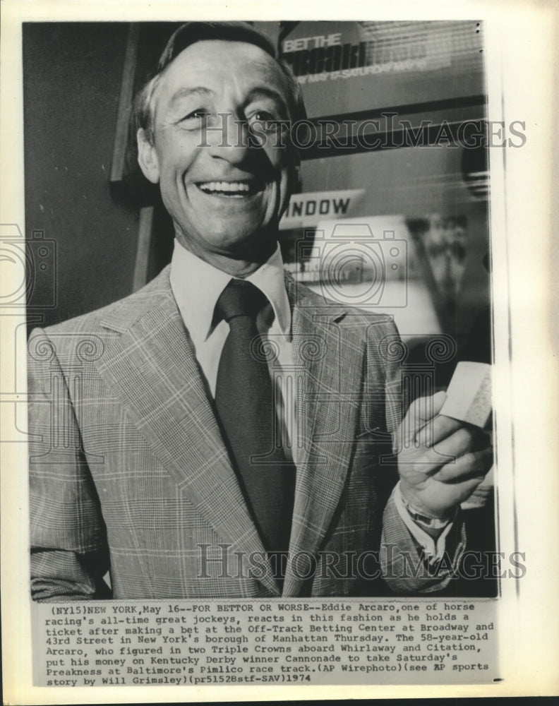 1974 Press Photo Famed jockey, Eddie Arcaro, holds bet ticket for Preakness race- Historic Images