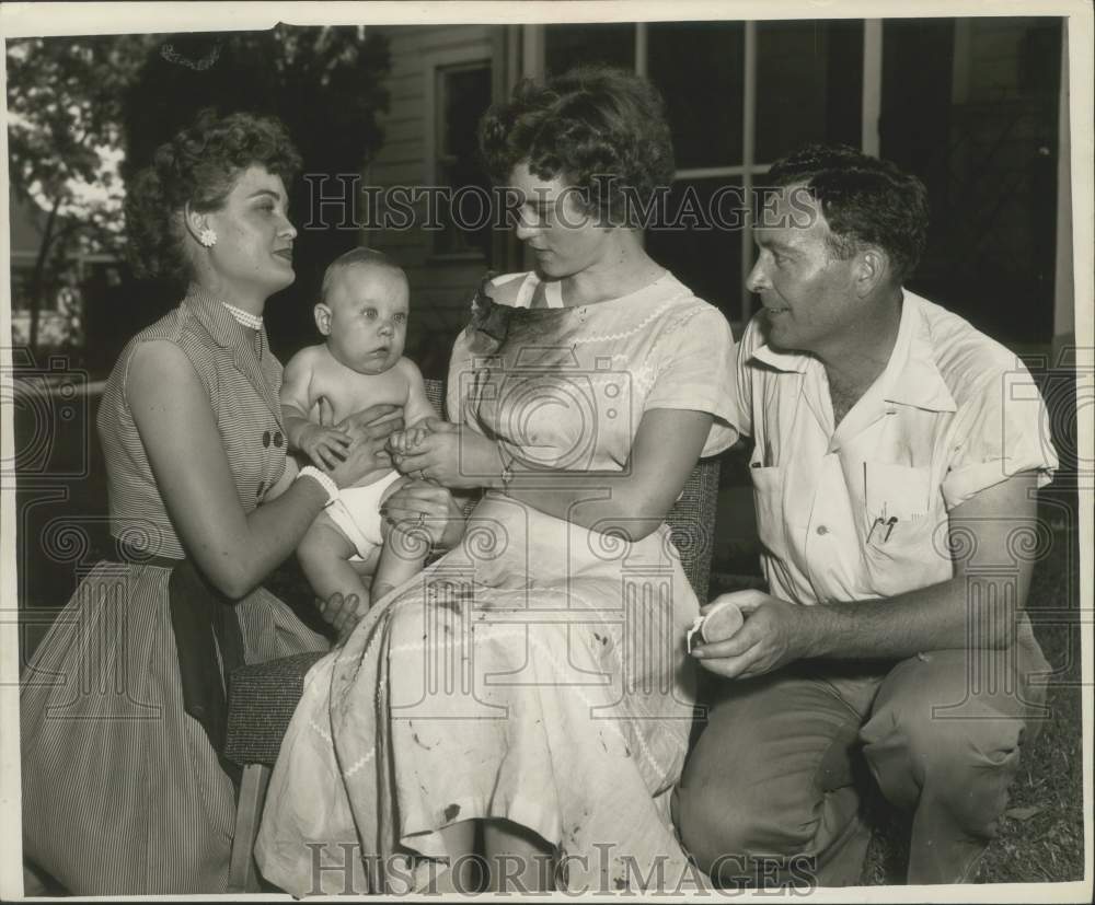 1953 Press Photo Victim of Alco Fireworks explosion reunited with her family- Historic Images