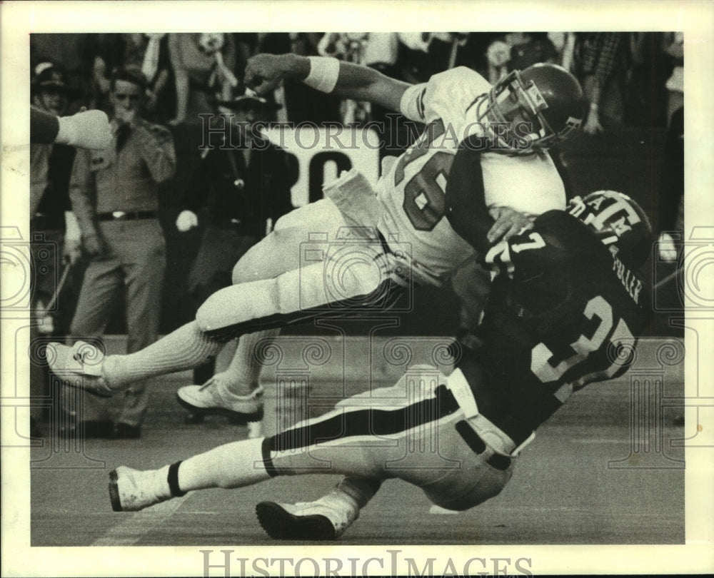 1982 Press Photo Louisiana Tech quarterback Matt Dunnigan hit in Texas A&M game- Historic Images