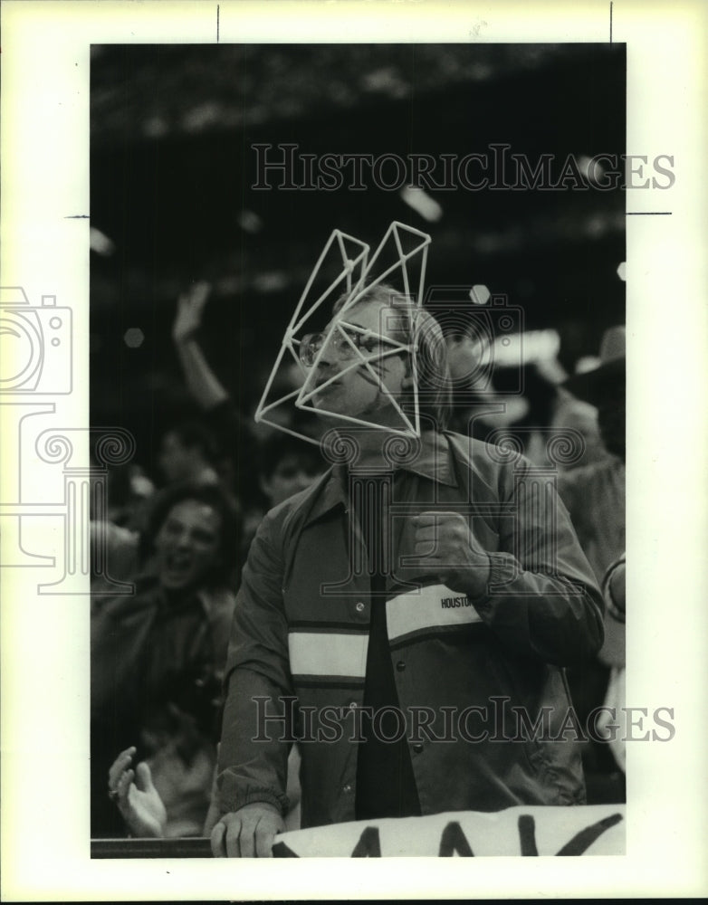 1988 Press Photo An aptly attired Houston Oilers fan cheers on the team.- Historic Images