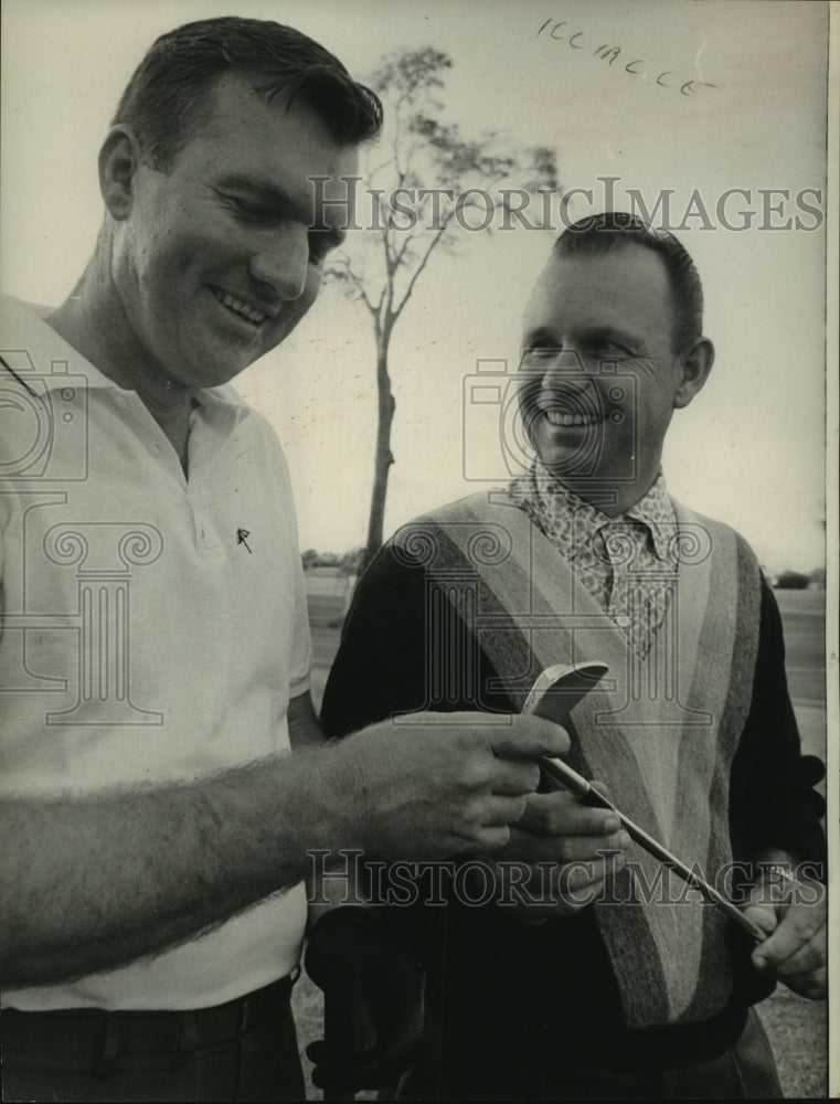 1965 Press Photo Golfer Don Collett looks at an iron. - hcs05989- Historic Images