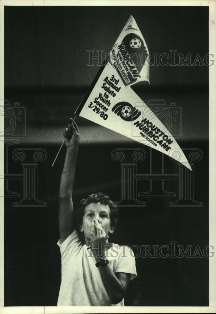 1980 Press Photo Young Houston Hurricane fan waves pennants at the ballpark.- Historic Images