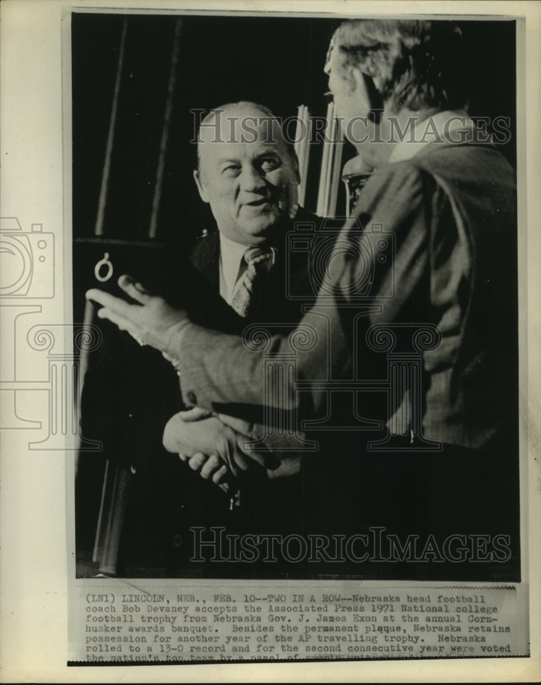 1972 Press Photo Nebraska coach Bob Devaney receives trophy from Governor Exon.- Historic Images