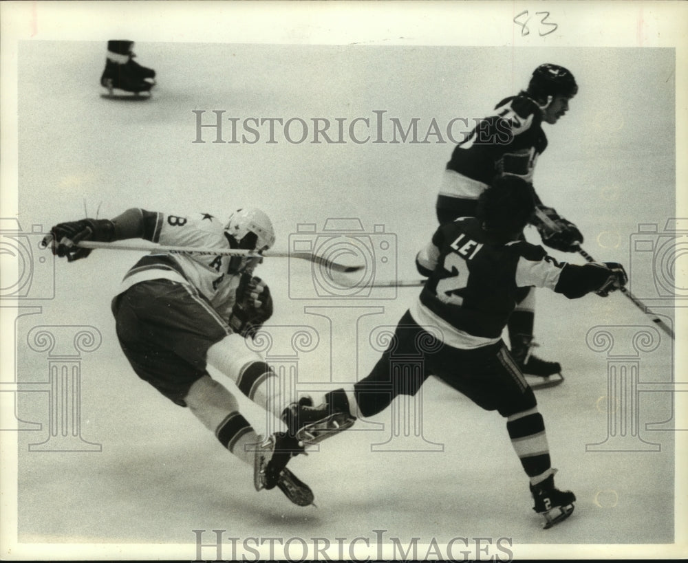 1976 Press Photo Houston Aeros&#39; hockey player gets tripped up and falls on ice.- Historic Images