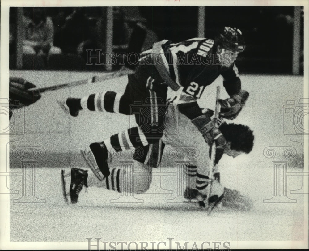 Press Photo Houston Aeros&#39; hockey player collides with Portland opponent.- Historic Images