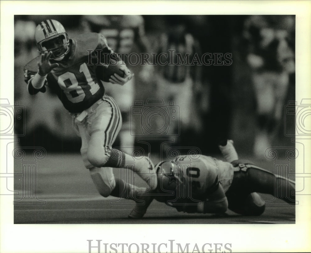 1986 Press Photo Houston Oilers&#39; Ernest Givins eludes Cowboys&#39; Bill Bates.- Historic Images