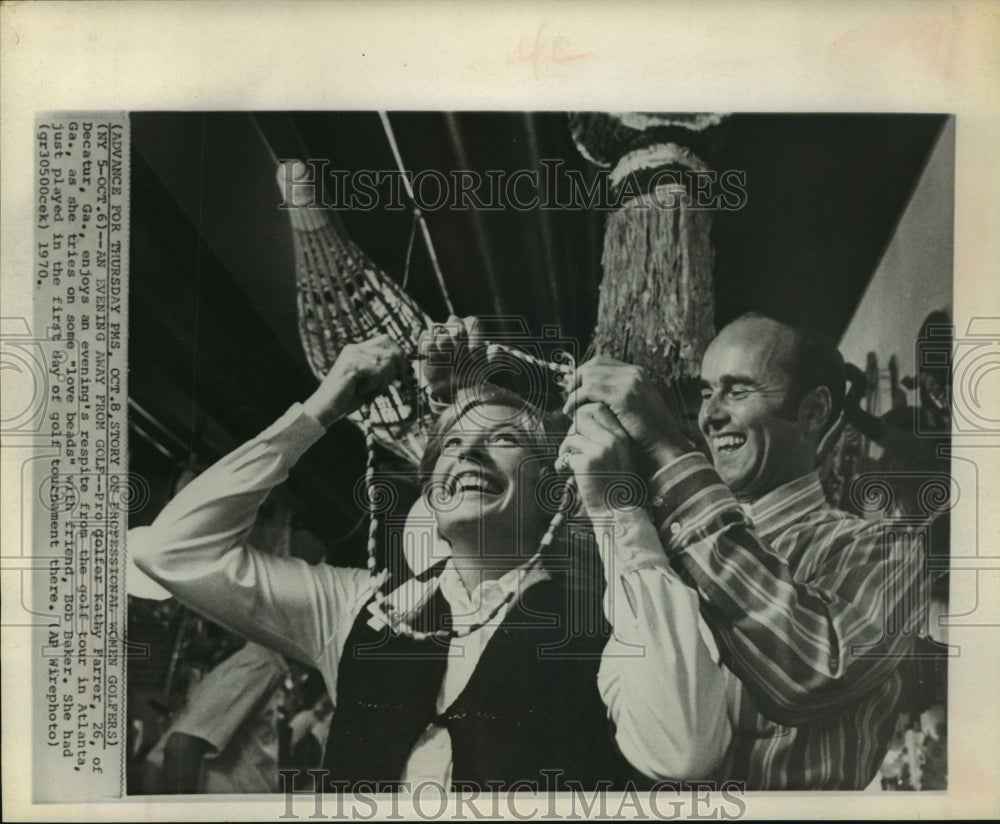 1970 Press Photo Golfer Kathy Farrer out on the town with Bob Baker in Atlanta.- Historic Images