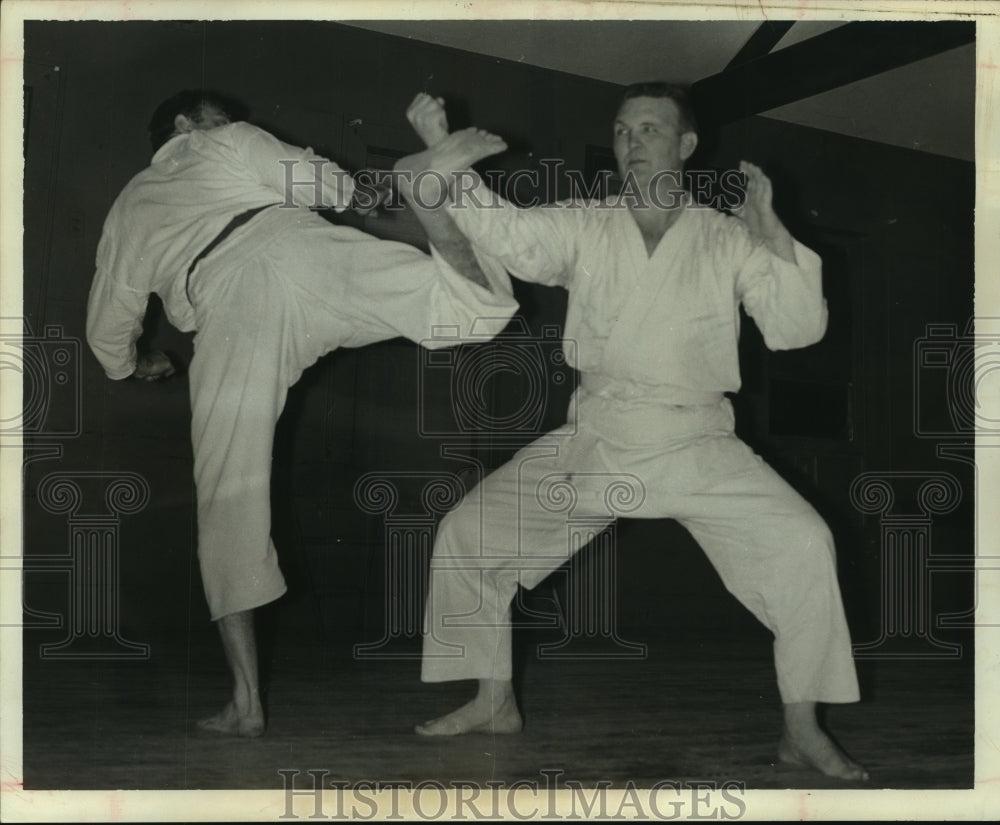 1966 Press Photo Billy McCoy blocks a karate kick by instructor Mike Richardson.- Historic Images