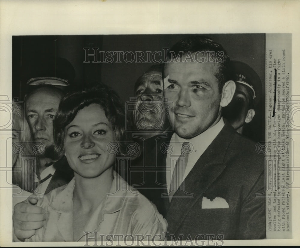 1961 Press Photo Boxer Ingemar Johansson leaves arena after Floyd Patterson loss- Historic Images