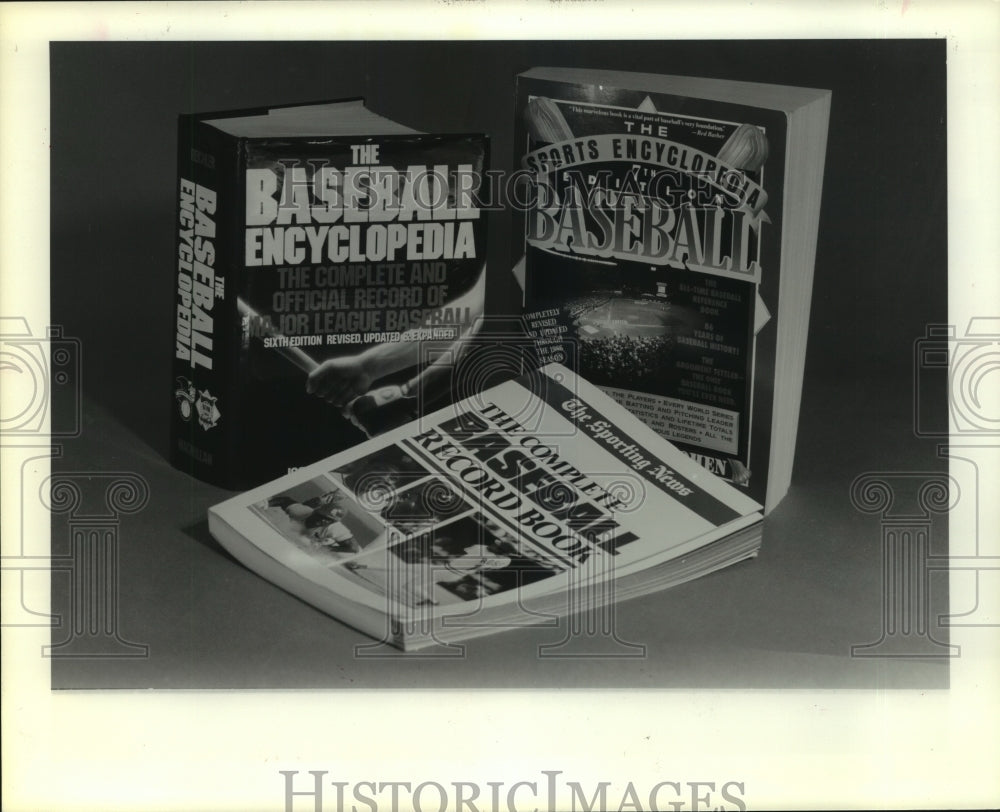 1987 Press Photo Three baseball statistics books available to numbers nut.- Historic Images