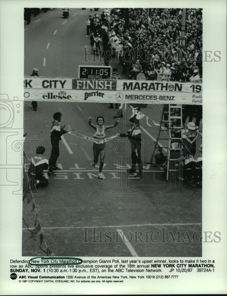 1987 Press Photo New York Marathon Champion Gianni Poli crosses finish line.- Historic Images