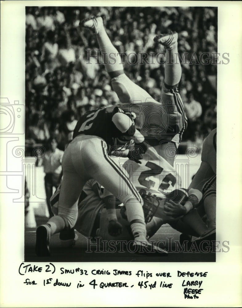 1982 Press Photo SMU's Craig James flips over defense for first down.- Historic Images