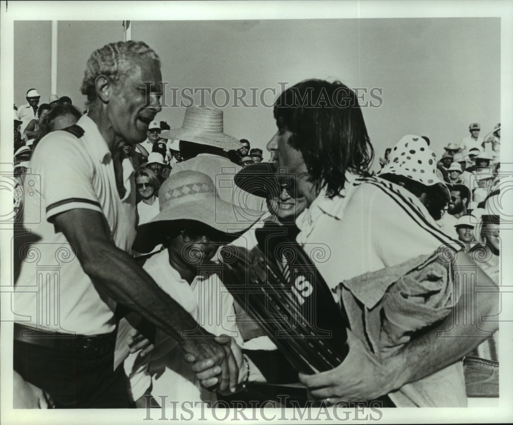 1979 Press Photo Pro tennis star Ilie Nastase shakes hands with fans.- Historic Images