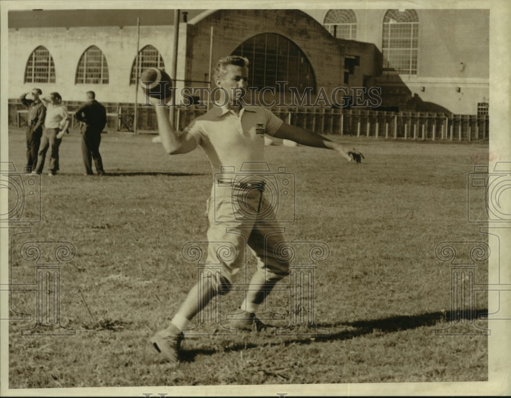 1958 Press Photo Football player throwing a football. - hcs09655- Historic Images