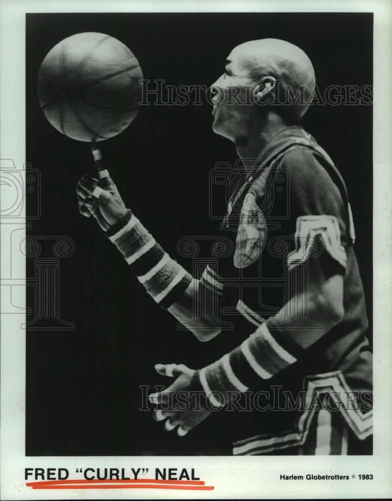 1983 Press Photo Harlem Globetrotters&#39; superstar Fred &quot;Curly&quot; Neal spins ball.- Historic Images