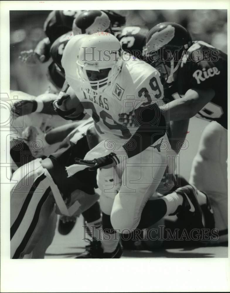 1992 Press Photo Texas&#39; Curtis Jackson is tackled by Rice&#39;s Bennett and Shirk.- Historic Images