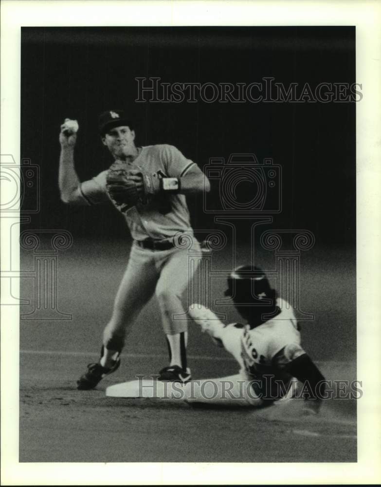 1986 Press Photo Astros' Jose Cruz slides into Dodgers' Steve Sax at second base- Historic Images