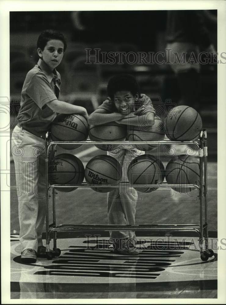 1983 Press Photo Houston Rockets&#39; ball boys watch warm ups. - hcs12407- Historic Images