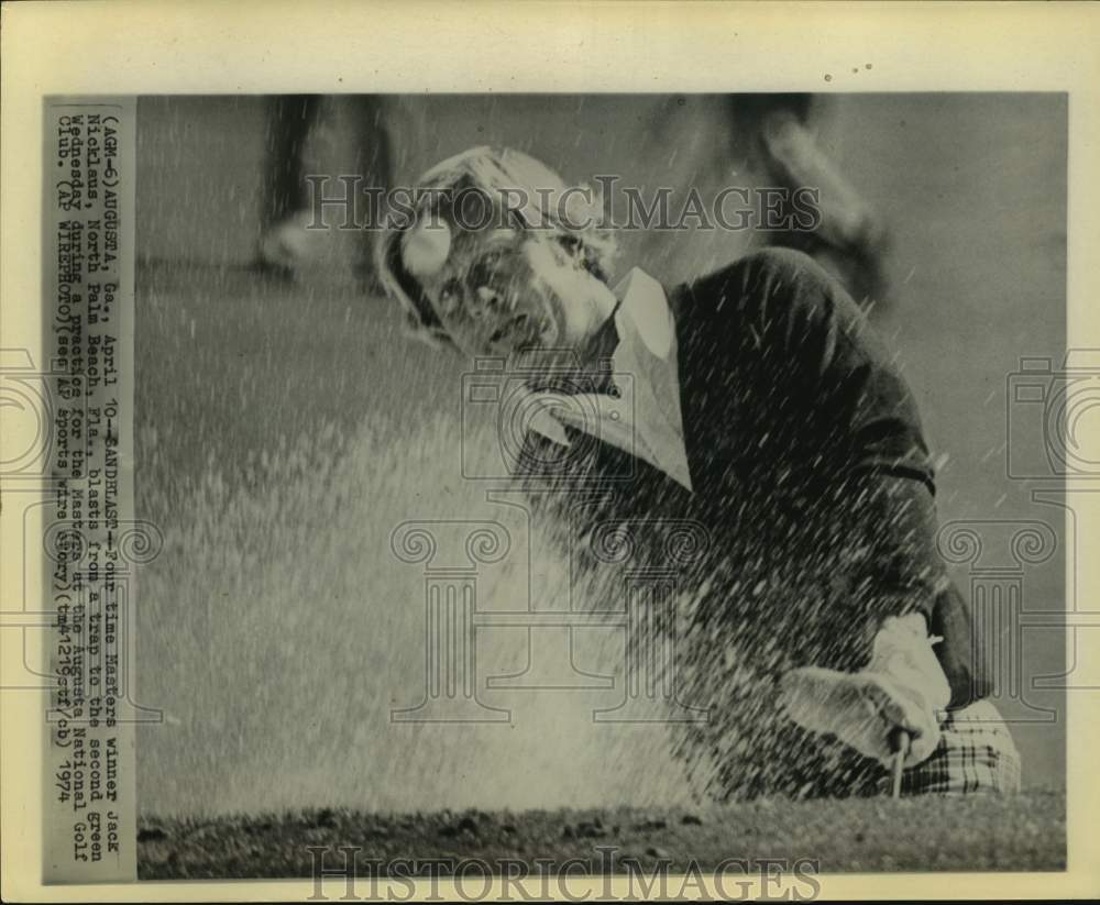 1974 Press Photo Jack Nicklaus hits from bunker at Augusta during practice round- Historic Images