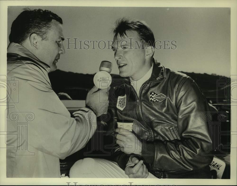 1966 Press Photo Host Jerry Smith talks with race car driver Dan Gurney.- Historic Images
