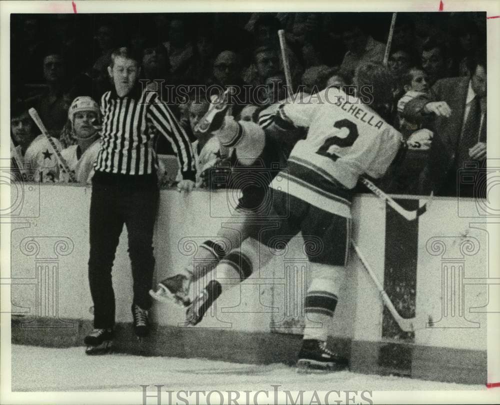 1975 Press Photo Houston Aeros&#39; John Schella checks an opponent into the boards.- Historic Images