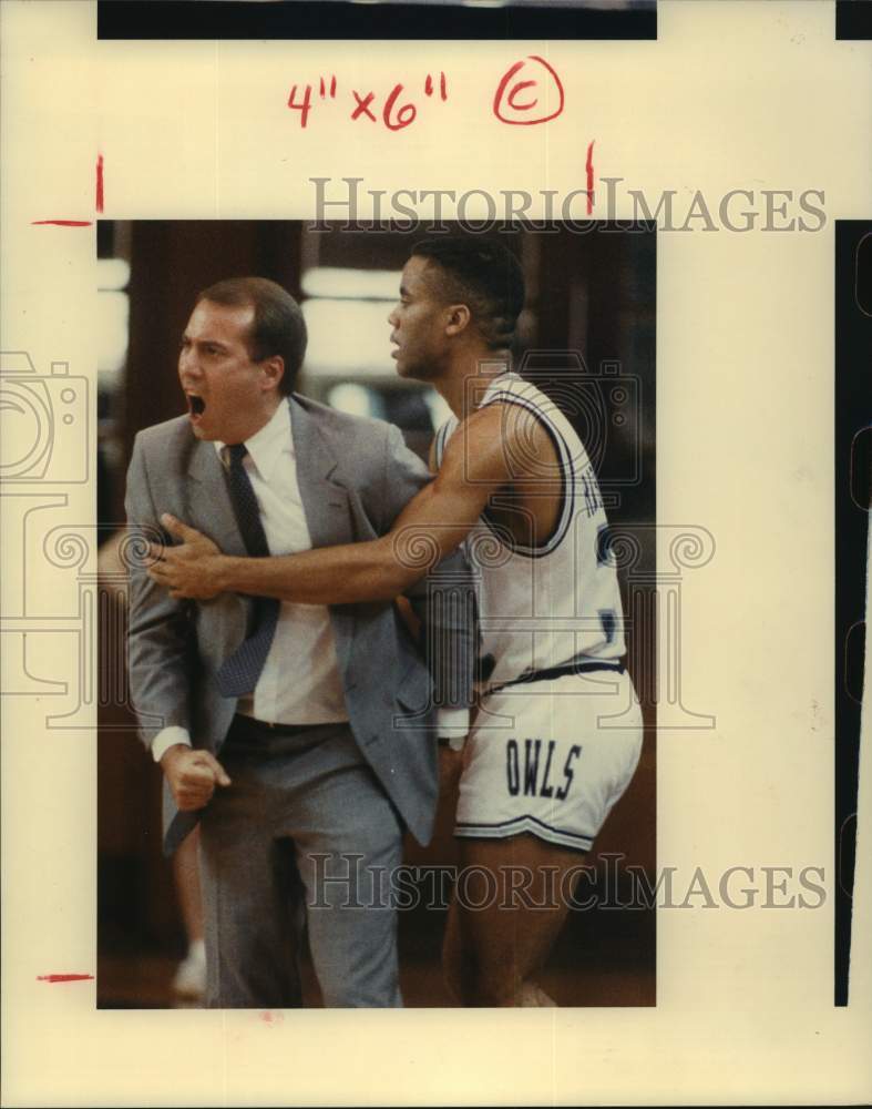 1988 Press Photo Rice's Ronald Robertson holds back coach Scott Thompson.- Historic Images