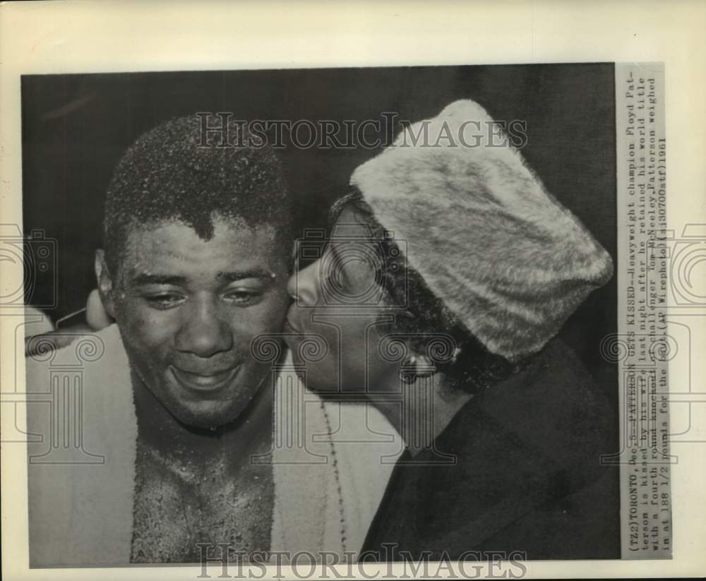 1961 Press Photo Boxing champ Floyd Patterson gets a kiss from wife after win- Historic Images