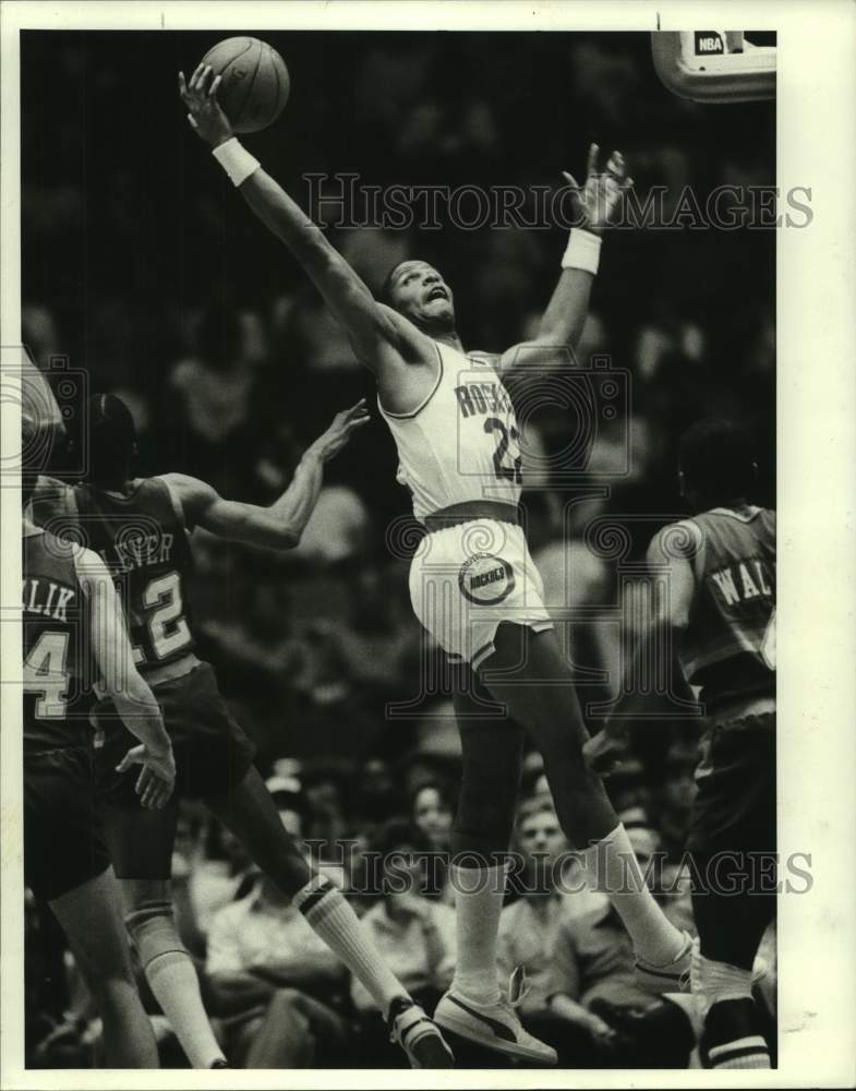 1987 Press Photo Rockets Rodney McCray grabs rebound against Denver Nuggets- Historic Images