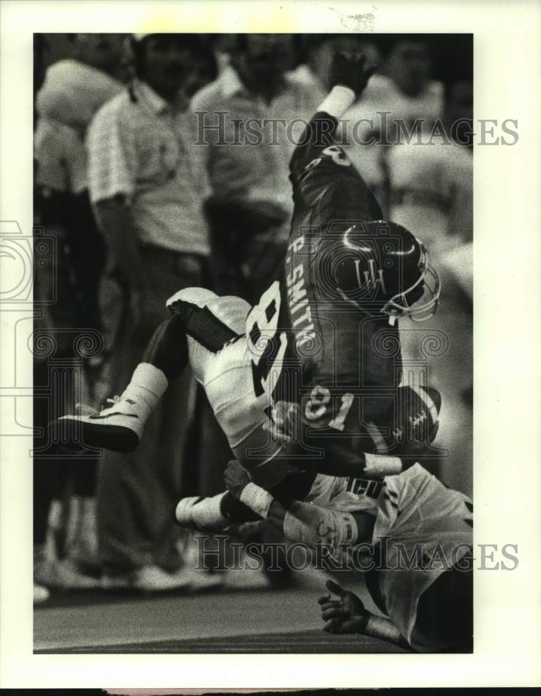 1988 Press Photo Houston&#39;s Paul Smith spins off TCU defender for extra yardage.- Historic Images