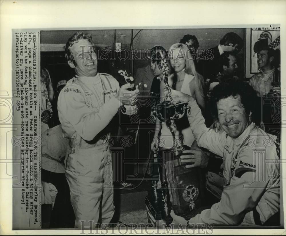 1973 Press Photo Race car drivers Hurley Haywood &amp; Peter Gregg celebrate FL win- Historic Images