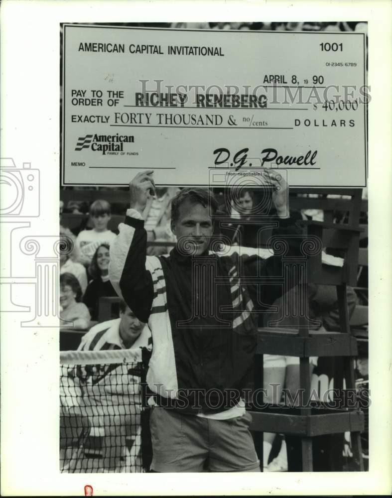 1990 Press Photo Tennis player Richey Reneberg holds up check for tourney win- Historic Images