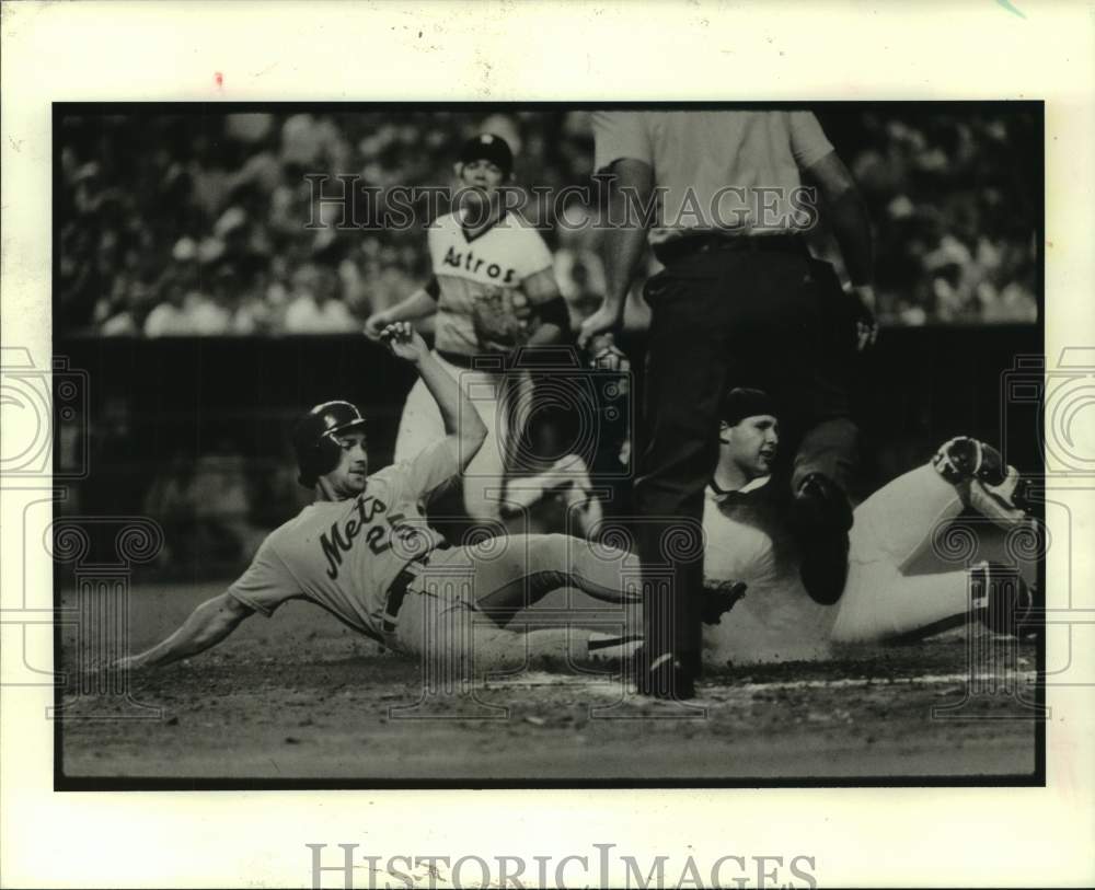 1985 Press Photo Mets player slides into home in game with Houston Astros- Historic Images