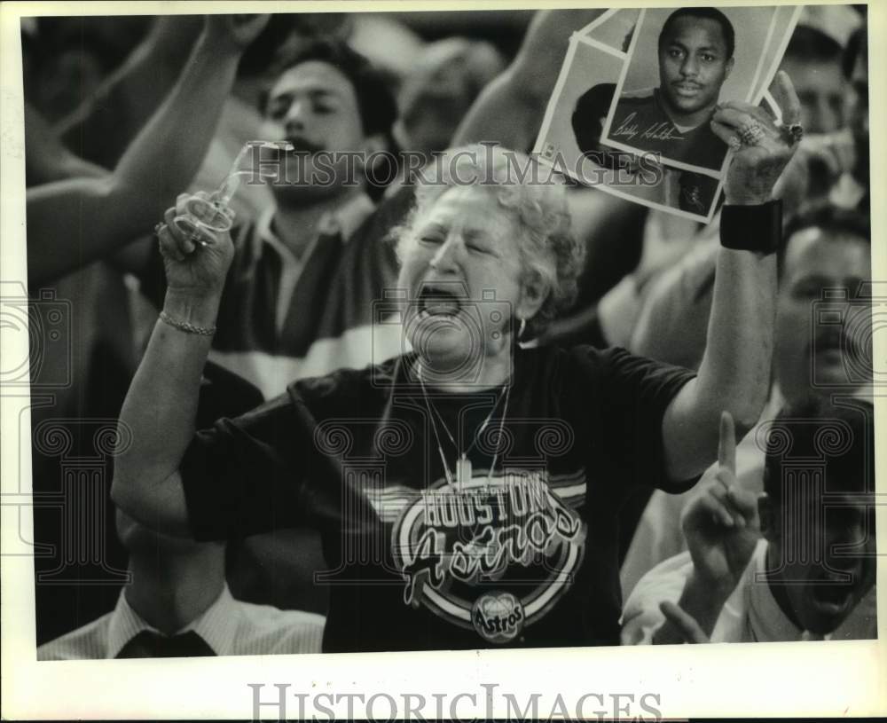 1986 Press Photo Astros fan Sofia Garza holds photos of her favorite Astros.- Historic Images