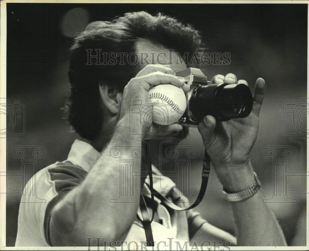 1980 Press Photo Houston Astros' fan takes pictures during game. - hcs20092- Historic Images