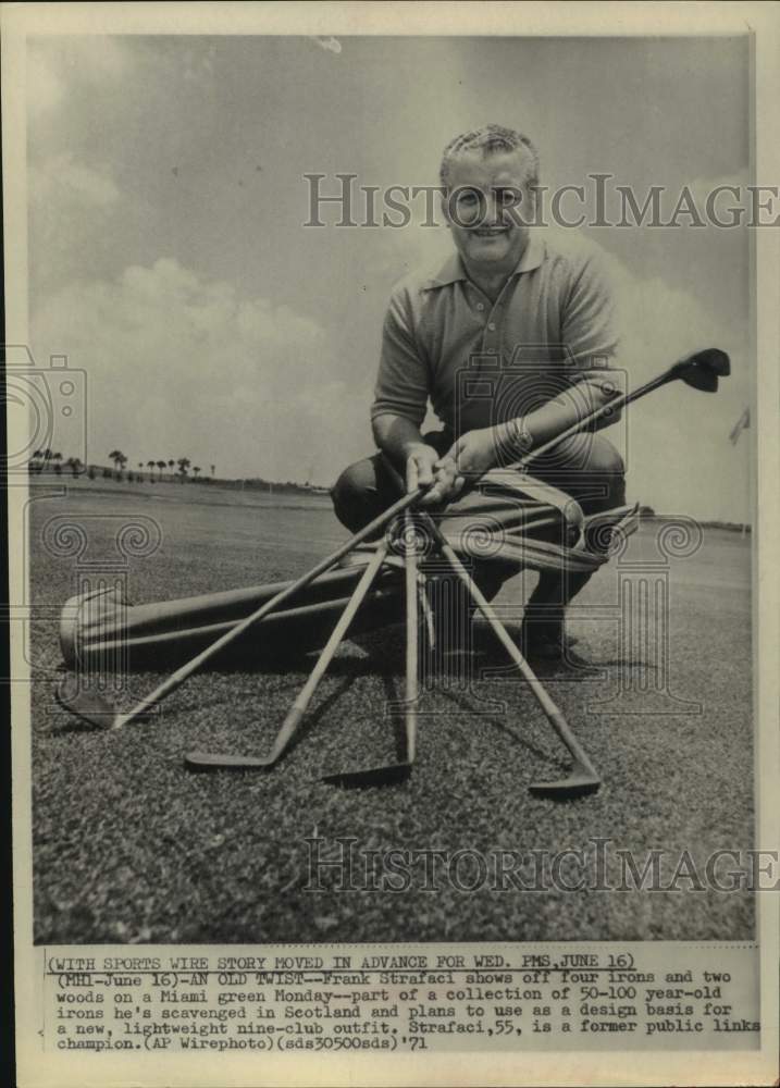 1971 Press Photo Golfer Frank Strafaci shows off antique clubs in Miami- Historic Images