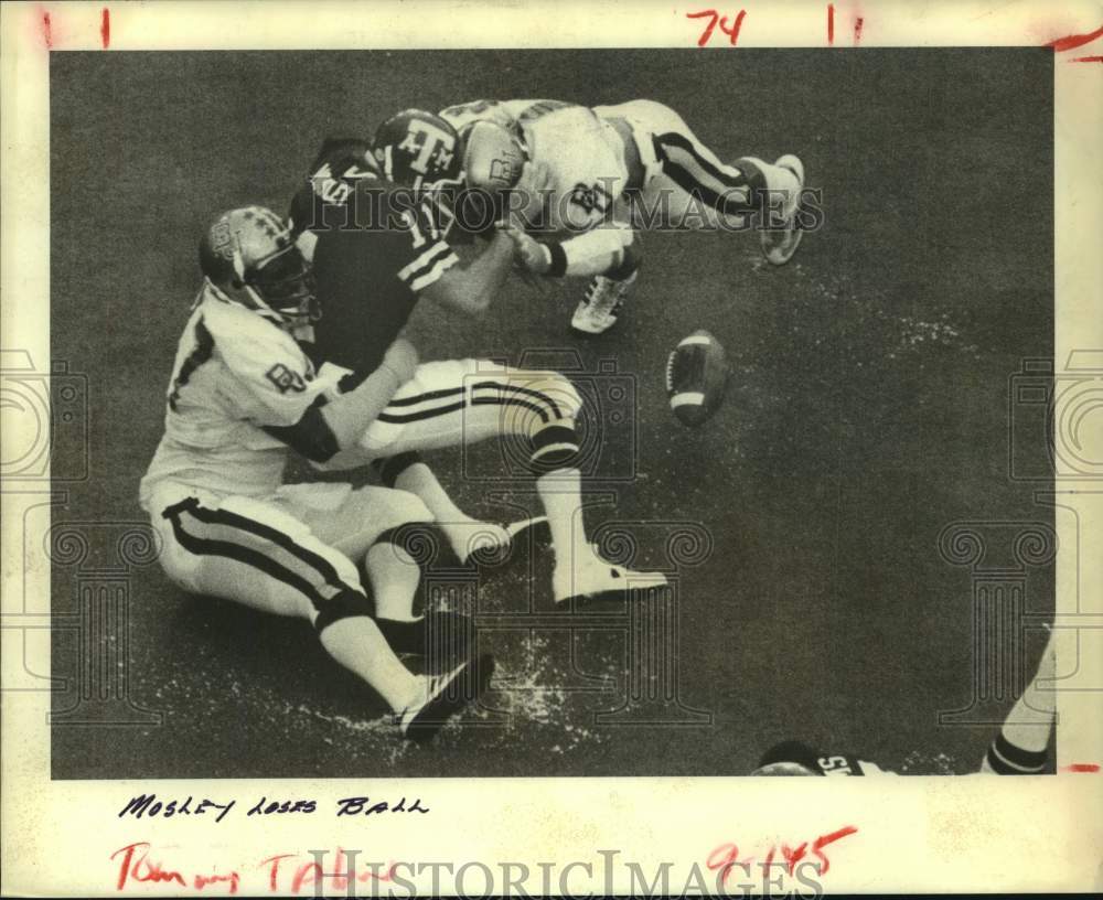 1980 Press Photo Texas A&M's Mike Mosley fumbles after Baylor pair's hit.- Historic Images