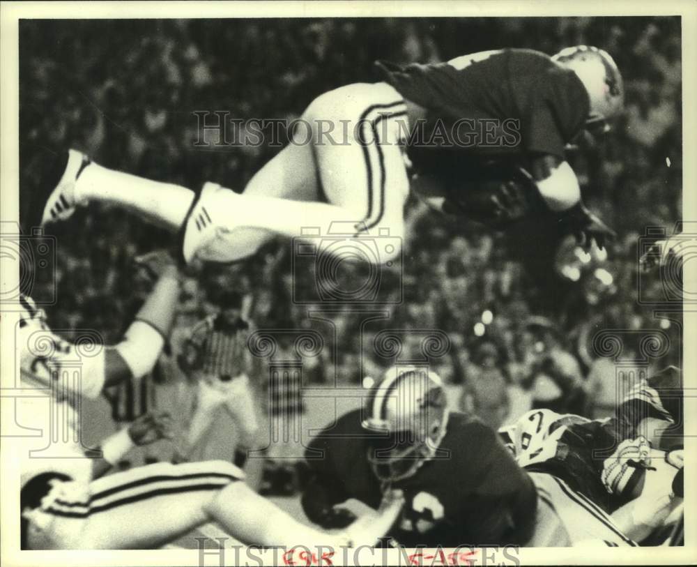 1979 Press Photo Rice University football player upended by opposing defense- Historic Images