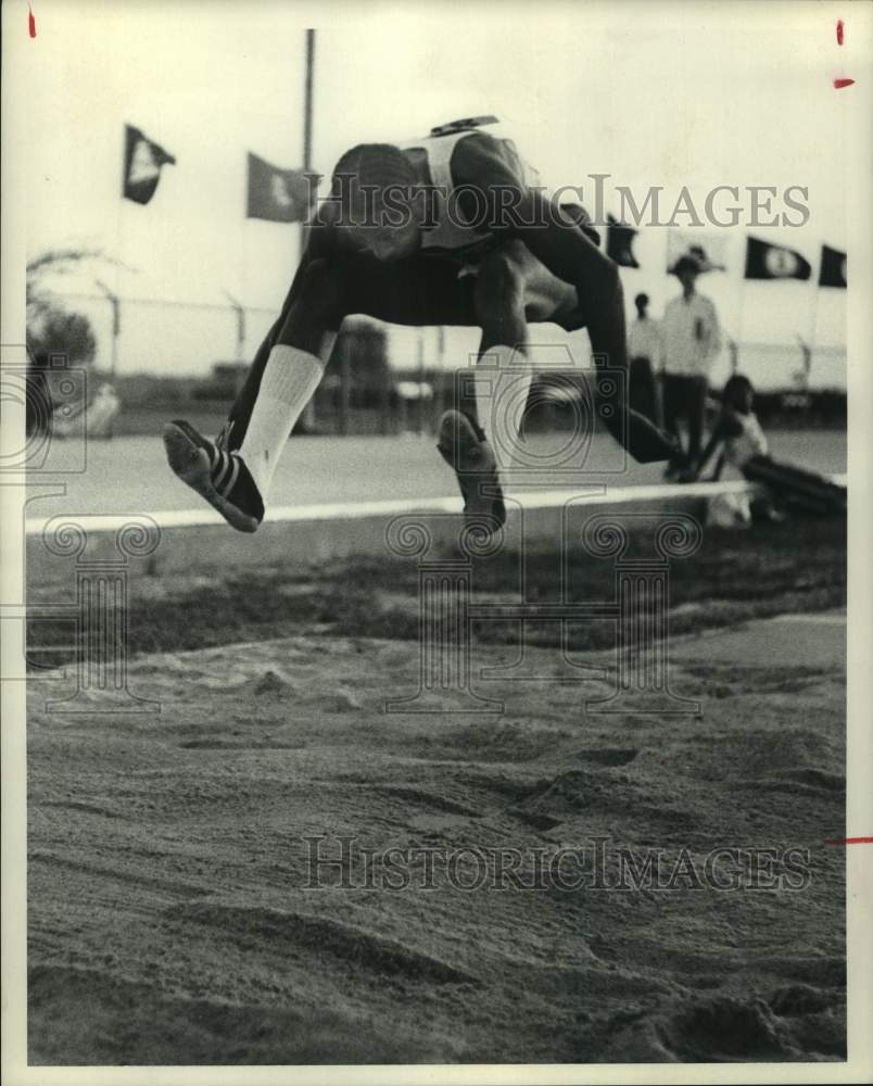 Press Photo Clarence Taylor in track and field competition in the Long Jump- Historic Images