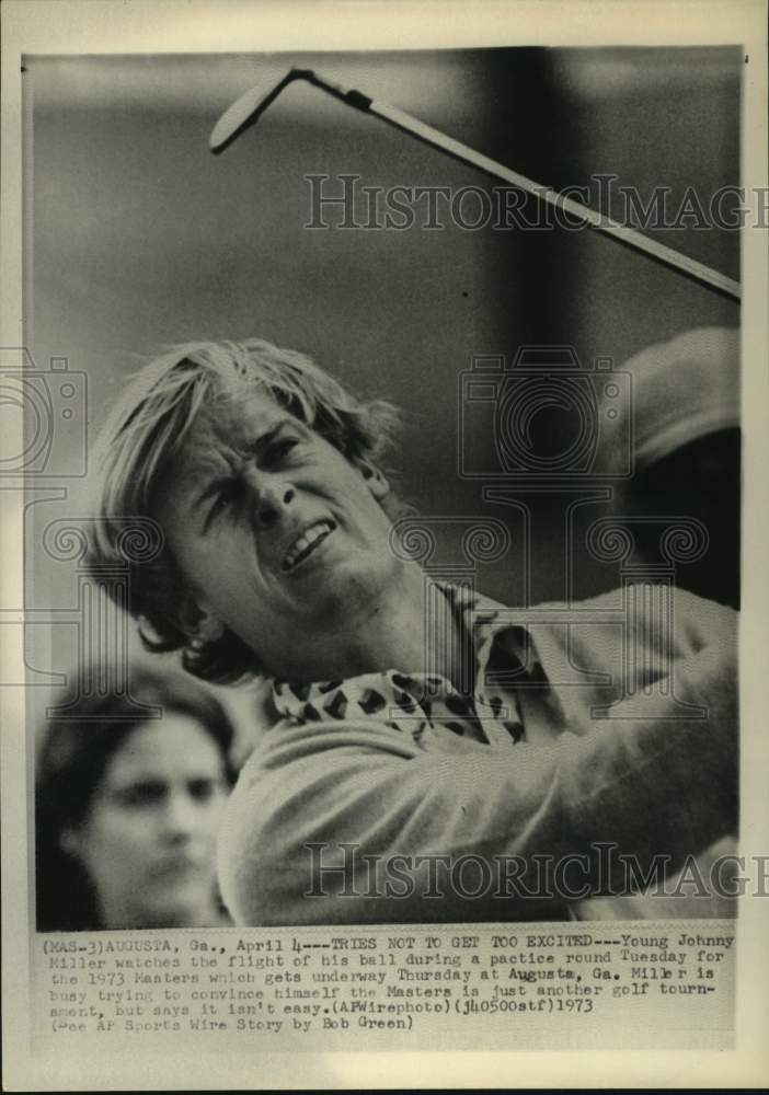 1973 Press Photo Golfer Johnny Miller watches his iron shot during practice- Historic Images