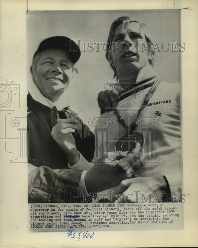 1974 Press Photo Kyle Rote Sr & Jr after latter won Superstars event & $53,400- Historic Images