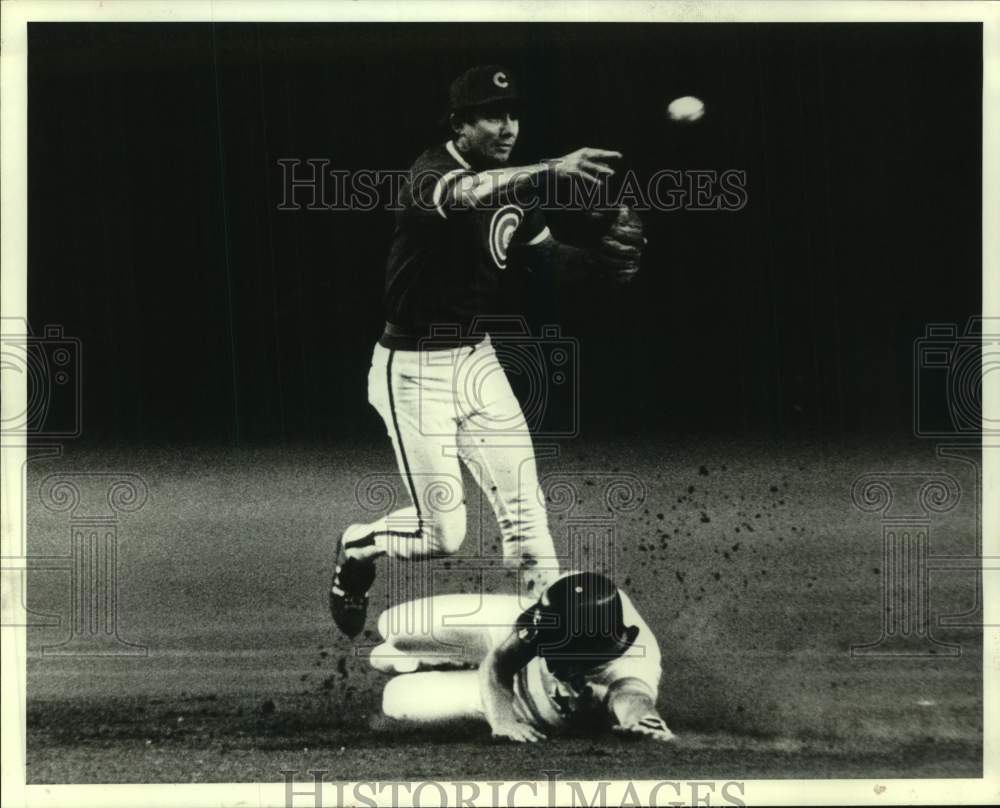 1984 Press Photo Cubs' Larry Bowa avoids Astro Bill Doran in double play attempt- Historic Images