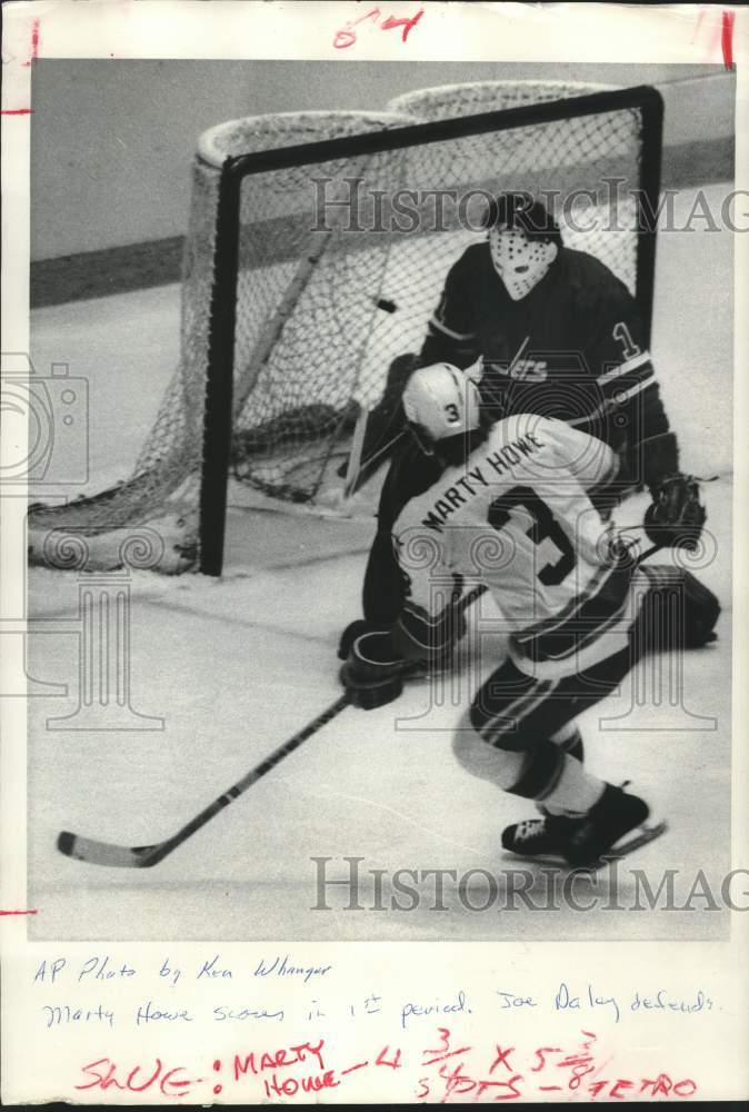 1977 Press Photo Hockey players Marty Howe and Joe Daley in action - hcs24868- Historic Images