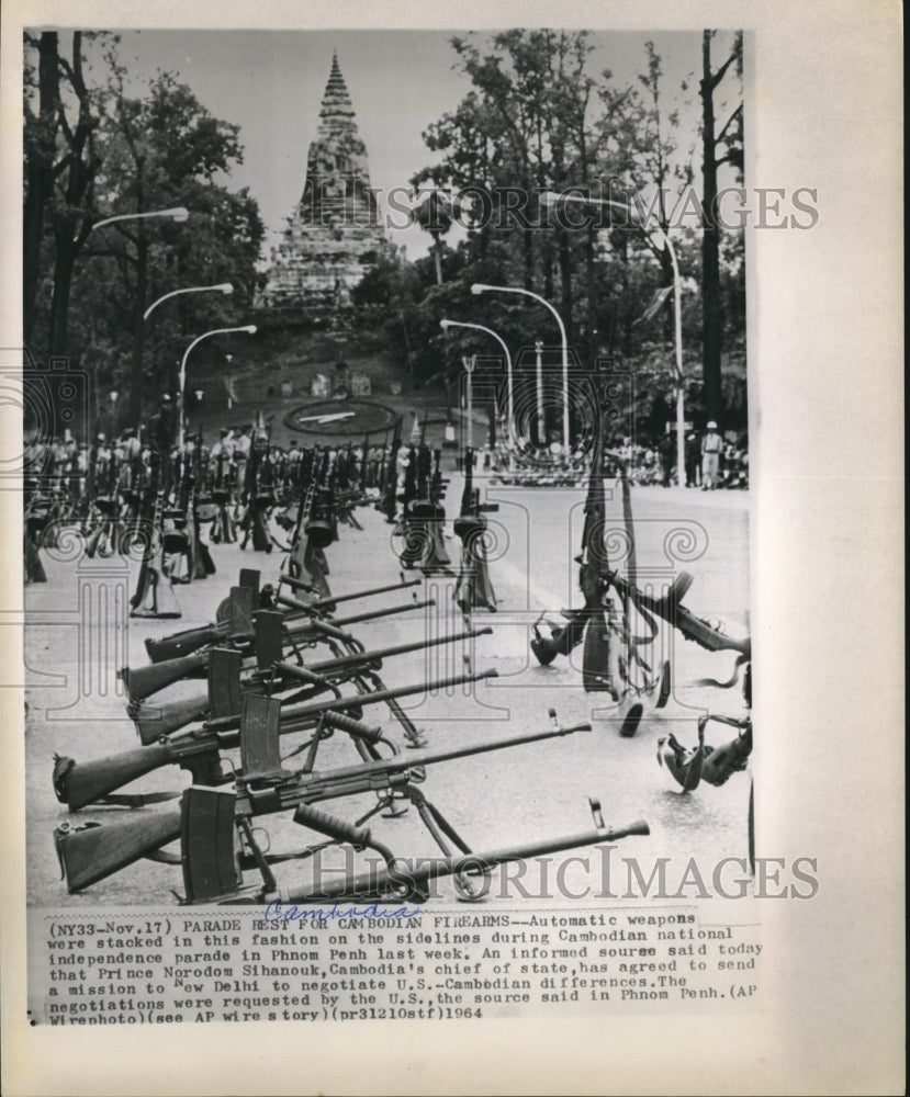 1964 Press Photo Automatic Weapons Stacked on Sidelines in Cambodia For Parade
